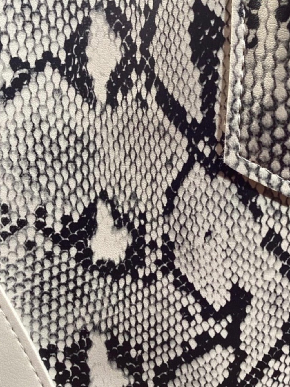 gorgeous shoulder bag features a unique, modern colorblock design